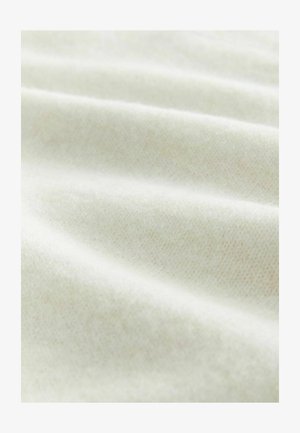 Gaiši krāsota auduma ar mīkstu tekstūru, ar nemanāmām krokām un nelielu spīdumu, izceļot gludu un vienmērīgu aušanas rakstu.