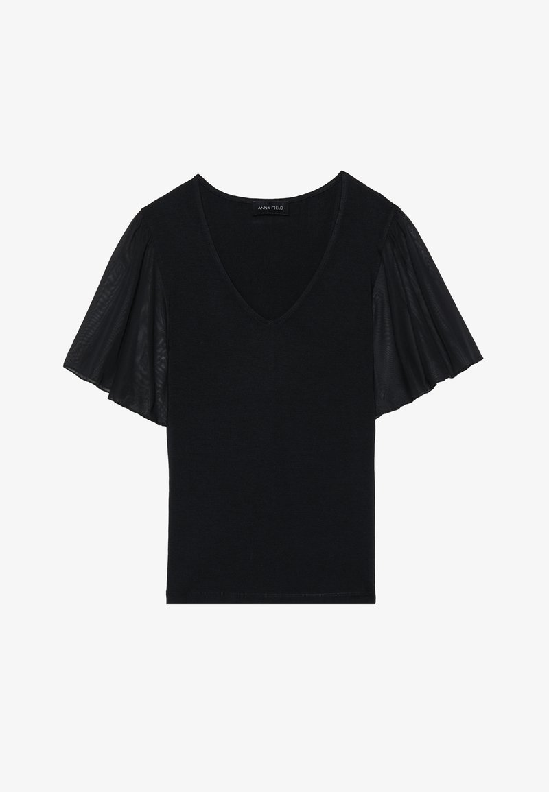 Haut noir avec un col en V et des manches flottantes en tissu transparent. Le corps principal est en texture unie, avec des détails accentués au niveau des manches.