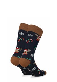 Granatowe skarpetki z brązowym ściągaczem, ozdobione świątecznymi wzorami: renifery, cukrowe laski, płatki śniegu i ostrokrzew. Wykonane z miękkiej, elastycznej tkaniny.