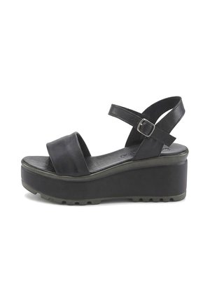 Black platform sandal with thick sole, adjustable ankle strap with buckle, and wide front strap.