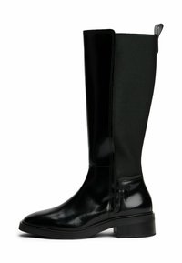 Black knee-high boot with smooth leather front, textured fabric back, low block heel, and pull tab at the top rear.