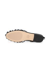 Semelle de sandale avec base beige, talon noir, clous décoratifs autour des bords, taille 39, marque CG par Cesare Garatini visible sur la semelle.