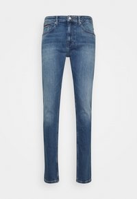 Mörkblå denimjeans med rak bendesign, fem fickor och subtila blekningar. Har en dragkedja och en märkespatch på ryggen.