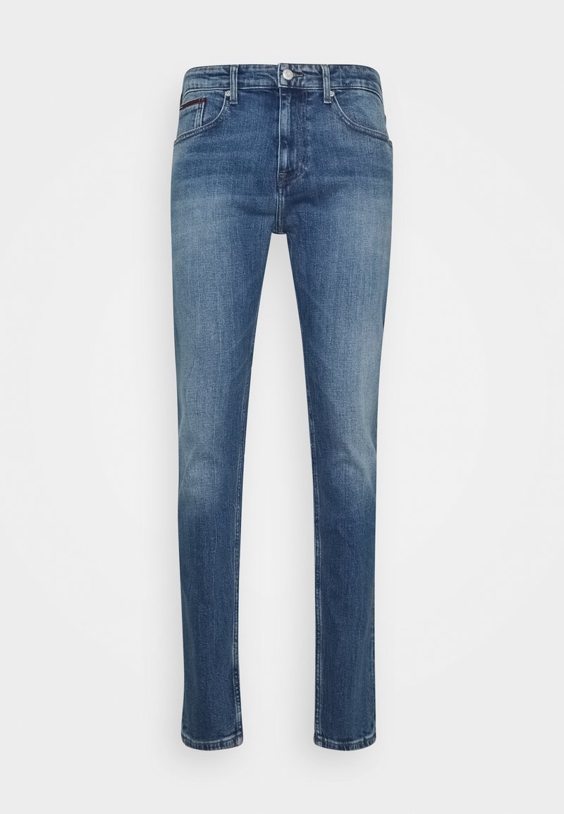 Mörkblå denimjeans med rak bendesign, fem fickor och subtila blekningar. Har en dragkedja och en märkespatch på ryggen.