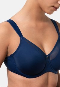 Toppavärinen bröstbehå i mjukt tyg med genomskinliga meshdetaljer, som har justerbara axelband, framknäppning och sömlösa kupor för en jämn look.