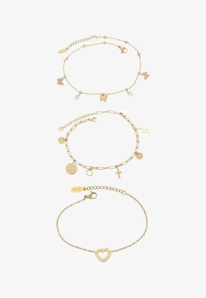 Kolme kultarannekoru: yksi perhosriipuksilla ja kristalleilla, ketju erilaisilla muodoilla, ja sydän jalokivillä.