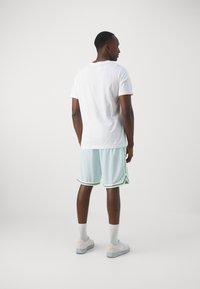 Nike Performance DNA SHORT - Sports shorts - glacier blue/barely volt/bright mandarin