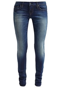 Jean bleu slim-fit avec légère décoloration sur les cuisses et détails usés, avec poches avant, passants de ceinture et fermeture par boutons.