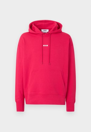 Svijetlo ružičasta hoodica s prednjim džepom i bijelim logotipom "MSGM" u sredini prsa, prikazana na jednostavnoj svijetloj pozadini.