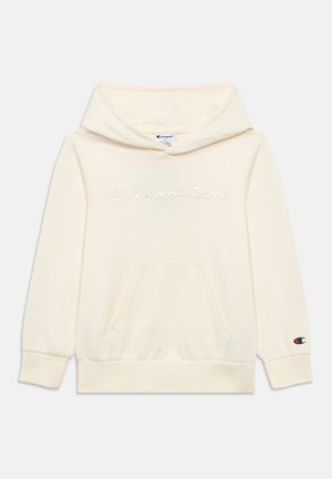 Kremfarget hettegenser laget av mykt stoff, med brodert "Champion"-logo, frontlommer og ribbestrikkede mansjetter.