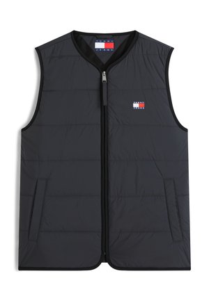 Veste matelassée noire sans manches avec fermeture éclair sur le devant, deux poches latérales, et petit logo Tommy Jeans rouge, blanc et bleu sur la poitrine.