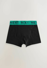 Čierne bavlnené boxerky s zeleným elastickým pásom s opakovaným textom "NEXT". Navrhnuté pre tesné padnutie, hladká textúra.