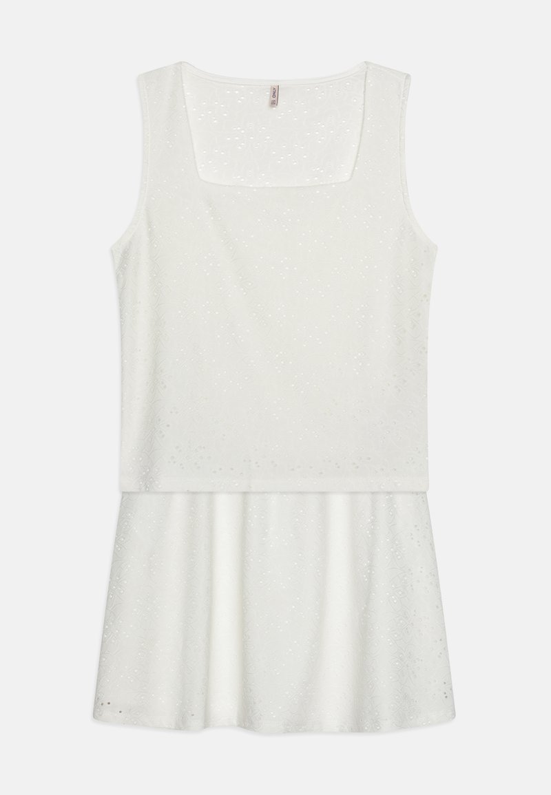 Balta suknelė su kvadratiniu iškirpimu, be rankovių, su tekstūruotu viršumi ir platesne sijonine dalimi. Medžiaga turi subtilius raštus.