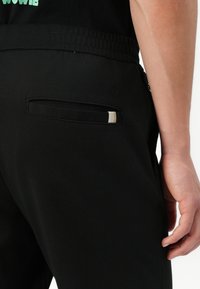 Jack & Jones JPSTACE NEO PANTS - Trousers - black