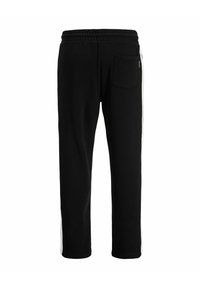 Sorte sweatpants med en afslappet pasform, udstyret med en hvid side-stribe, elastisk talje og en baglomme på højre side.