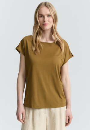 T-shirt a maniche corte, verde oliva, con scollo rotondo e vestibilità rilassata, realizzata in tessuto morbido e liscio.