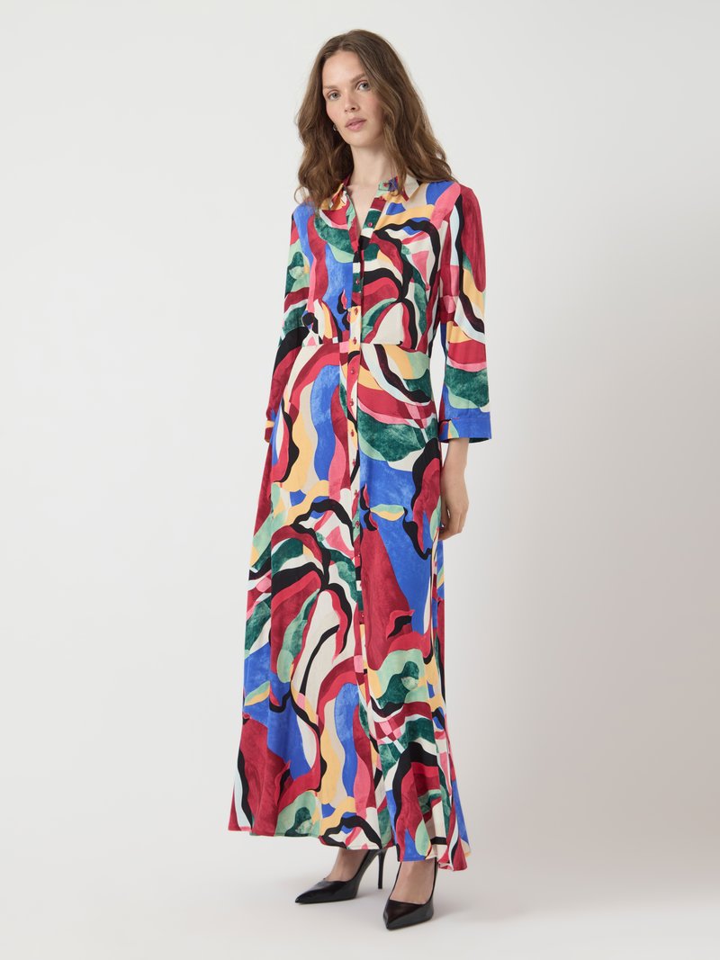 Long, multicolored dress featuring abstract swirls of red, blue, green, and yellow. Button-down front and three-quarter sleeves. Smooth fabric.