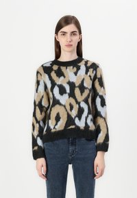 Knit sweater featuring a leopard print in black, beige, and light blue. Includes long sleeves and a crew neckline. Soft, textured fabric.