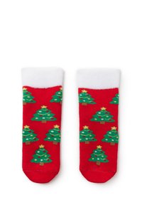 Red socks featuring a pattern of green Christmas trees with yellow stars and ornaments, bordered with a white cuff. Soft knit material.