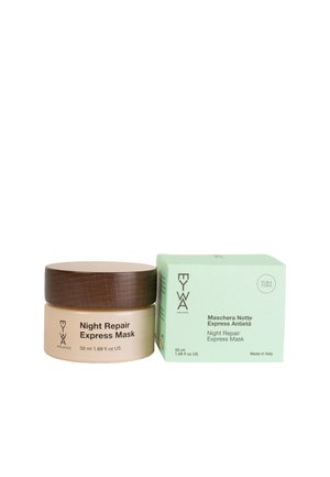 Maschera Notte Riparatrice Express in un barattolo di vetro opalino con coperchio in legno, abbinata a una scatola verde chiaro con testo. Capacità di 50 ml.