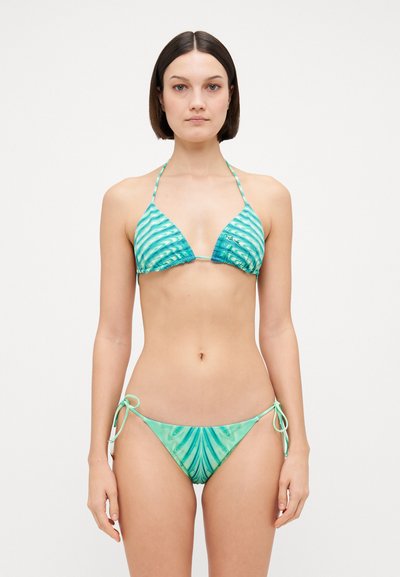 Triangle bikini set in teal with wave patterns. Soft material, adjustable ties on the top and bottom, featuring a smooth texture.