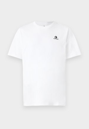 T-shirt en coton blanc à manches courtes, avec un petit logo Converse noir sur le côté gauche de la poitrine. Design simple et épuré.