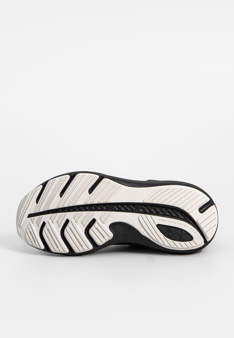 Suela de zapato atlético negro con un patrón texturizado y surcos de tracción blancos, diseñada para una alta durabilidad y agarre.