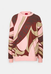 Sweat-shirt à col rond avec un motif abstrait rose, marron et beige, manches longues et bord-côtes aux poignets et à l'ourlet.