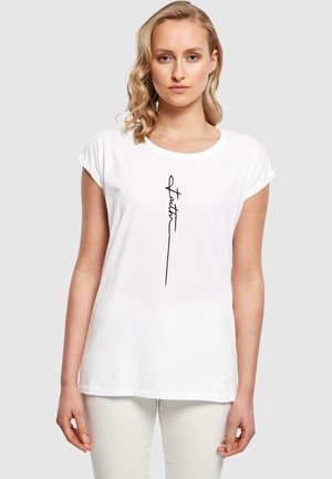 Weißes T-Shirt mit kurzen Ärmeln, locker geschnitten und mit einem hervorgehobenen schwarzen, geschwungenen "Faith"-Grafik auf der Vorderseite. Aus weichem Baumwollmaterial und entspannter Passform.