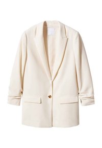 Krémový blazer s jedním zlatým knoflíkem, dvěma předními kapsami, strukturovanými rameny a dlouhými rukávy, vyrobený z hladkého materiálu.