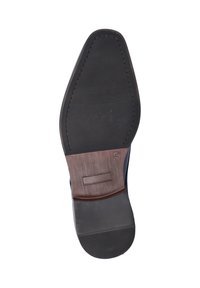 Zwarte rubberen zool met een gladde textuur, verhoogde ribbels nabij de hiel en een gestikte bruine accent bij het midden. Maat gemarkeerd als 42.