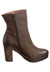 Bottine en cuir marron avec un talon bloc haut, détail de fermeture éclair sur le côté et finition lisse. Dotée d'un bout arrondi et d'une semelle légèrement texturée.