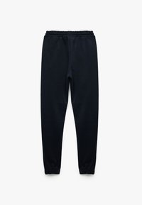 Marineblaue Jogginghose aus weichem Material, mit elastischem Bund und schmal zulaufenden Bündchen an den Knöcheln.