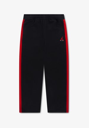 Pantalon de survêtement noir avec bandes latérales rouges, taille élastique et petit logo Jumpman Air rouge sur la cuisse gauche.