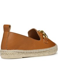 Brown leather espadrille with a cut-out design. Features a jute-wrapped sole and gold-tone hardware accent near the front. Soft texture.