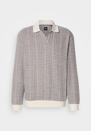Long-sleeve knit polo sweater with textured brown and white pattern, cream collar, and cream ribbed cuffs and hem.