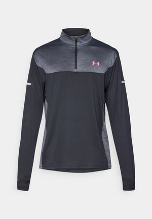 Black long-sleeve pullover with a quarter zip, featuring a gradient gray chest, pink logo, and reflective accents on sleeves.