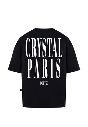 T-shirt nera oversize con grande testo bianco: "CRYSTAL PARIS" e "DEPT.75" stampato sul retro. Realizzato in tessuto morbido, maniche corte.