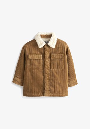 Veste en velours côtelé marron avec col en fausse fourrure blanche, fermeture à boutons, deux poches à rabat sur la poitrine et manches longues.