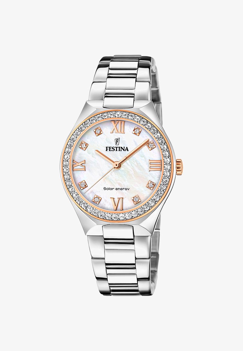 Festina saules enerģijas pulkstenis ar nerūsējošā tērauda siksniņu, apaļu pērļu ciparnīcu, rozā zelta akcentiem un kristālu izrotātu rāmīti.