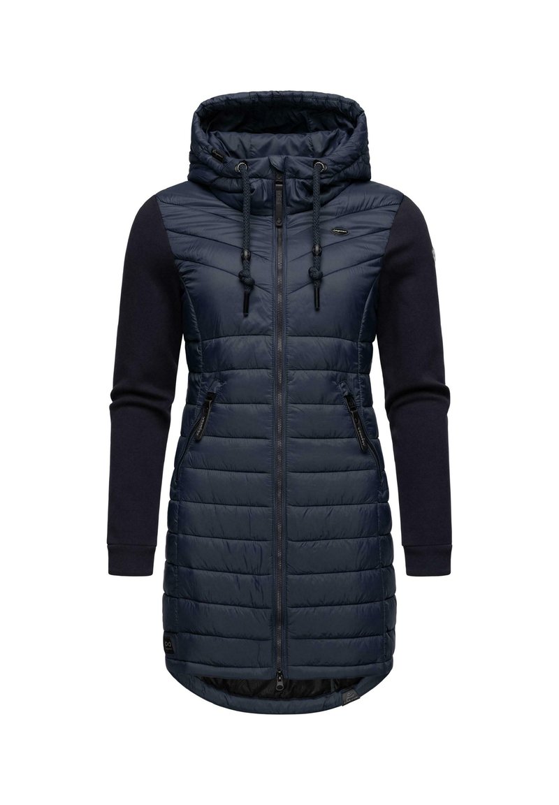 Jūras spēku zils polsterēts mētelis ar rāvējslēdzēju priekšā un regulējamu kapuci. Tam ir vienkrāsaini džemperu piedurknes un sānu kabatas, ar quilted tekstūru.