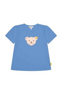 Camiseta de algodón azul con un aplique de cara de oso en crema con detalles marrones y un pequeño detalle amarillo. Mangas cortas y abullonadas.