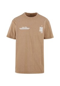 Brown cotton t-shirt with short sleeves. Features white text graphic on the front, including phrases and stylized lettering.
