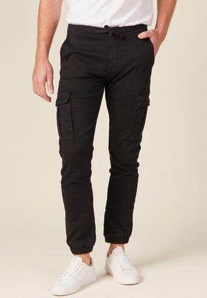 NIEDRIGE ENGE KAMPF - Cargo trousers - noir