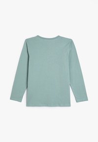Koszulka z długim rękawem w jasnym miętowym kolorze, wykonana z miękkiego materiału. Posiada klasyczny okrągły dekolt i prosty design bez wzorów.