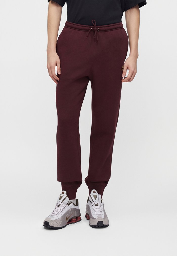 Nike Pantalones deportivos - burgundy crush/metallic gold-coloured