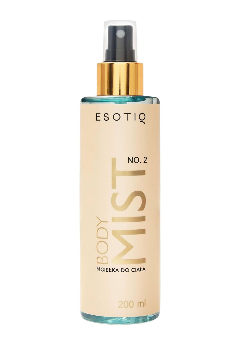 Przezroczysta butelka z rozpylaczem w kolorze złotym. Jasnoróżowa etykieta z napisem "BODY MIST" w wyraźnej złotej czcionce. Pojemność: 200 ml.