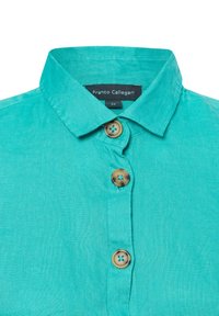 Turquoise linnen overhemd met een standaard kraag, voorzien van drie lichtbruine knopen en een label met de tekst "Franco Callegari", maat 36.