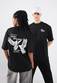 YOURTURN by Zalando - UNISEX - T-Shirt print - true black Thumbnail-Bild 1