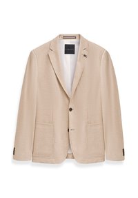 Beige Blazer aus strukturiertem Stoff mit zwei Fronttaschen, einem Ein-Knopf-Verschluss und einem kleinen metallischen Akzent am Revers.